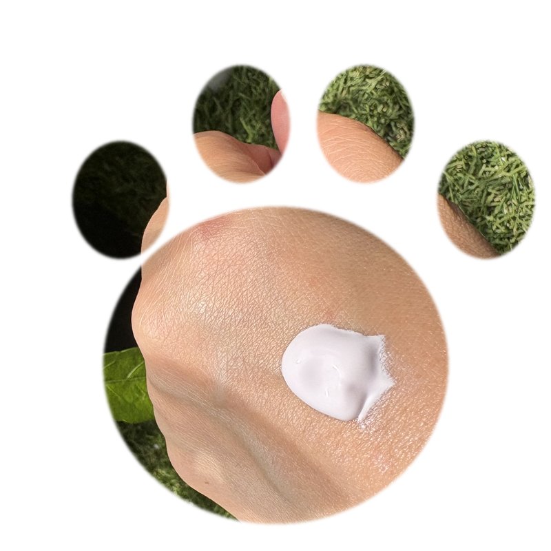 Skin Aqua Tone Up UV Essence lavender swatch in a cat paw shape