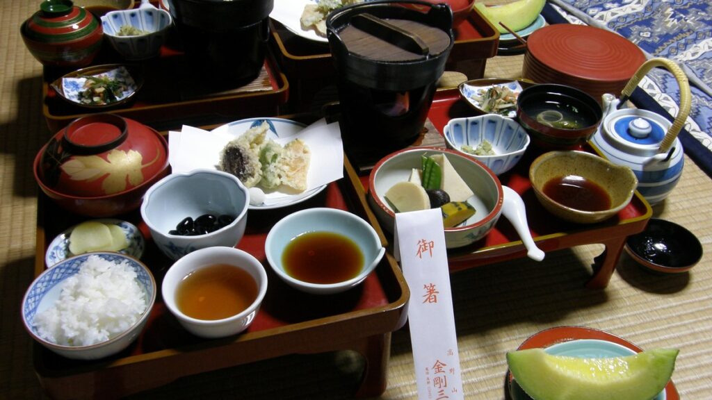 Shojin ryori Buddhist vegetarian dinner served on red lacquer trays at a Koyasan temple lodging