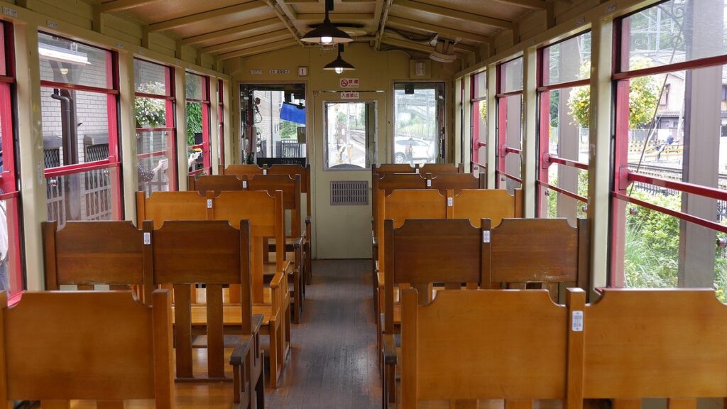 Wooden seats inside a Sagano Romantic Train car