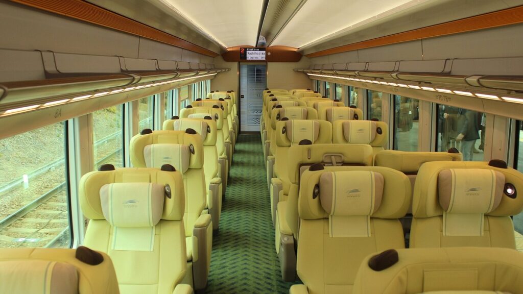 Rows of premium seats inside the Kintetsu Shimakaze train